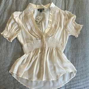 Bebe Women’s blouse, short sleeved v neck